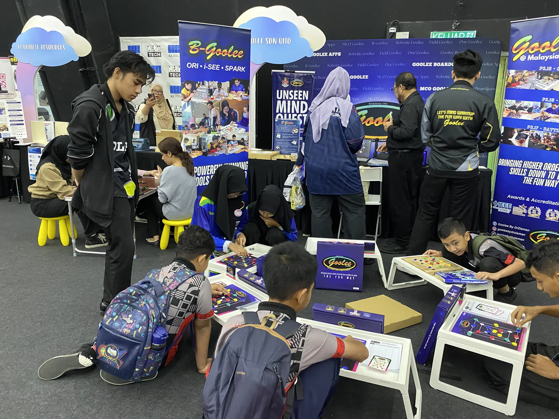 Visitors playing Goolee at the Hari Istimewa Sains exhibition booth